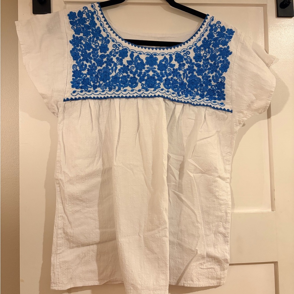 White Blouse with Navy Trim and Embroidered Accent